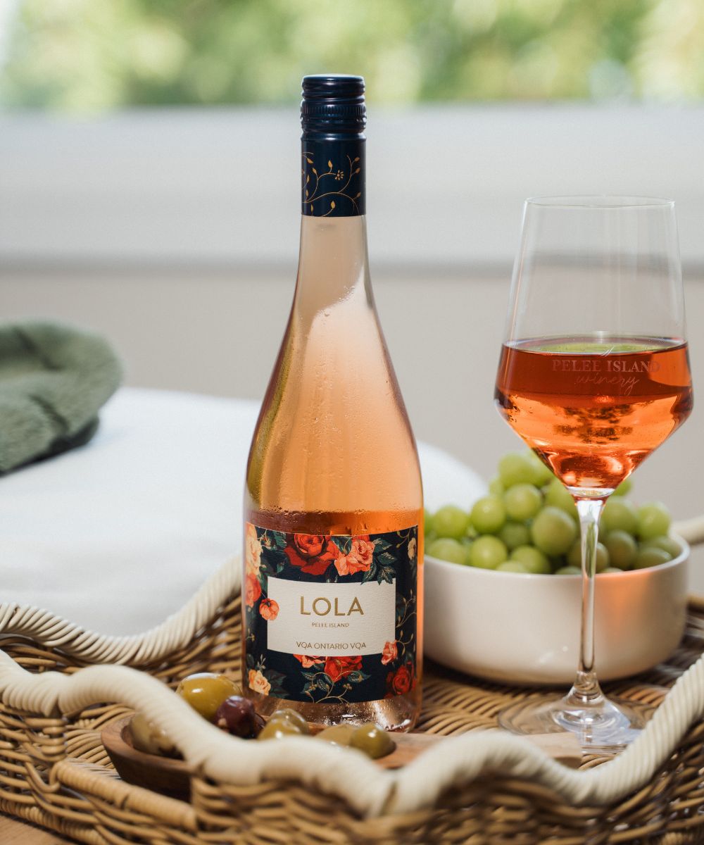 LOLA Sparkling Rose with wine Glass and Grapes