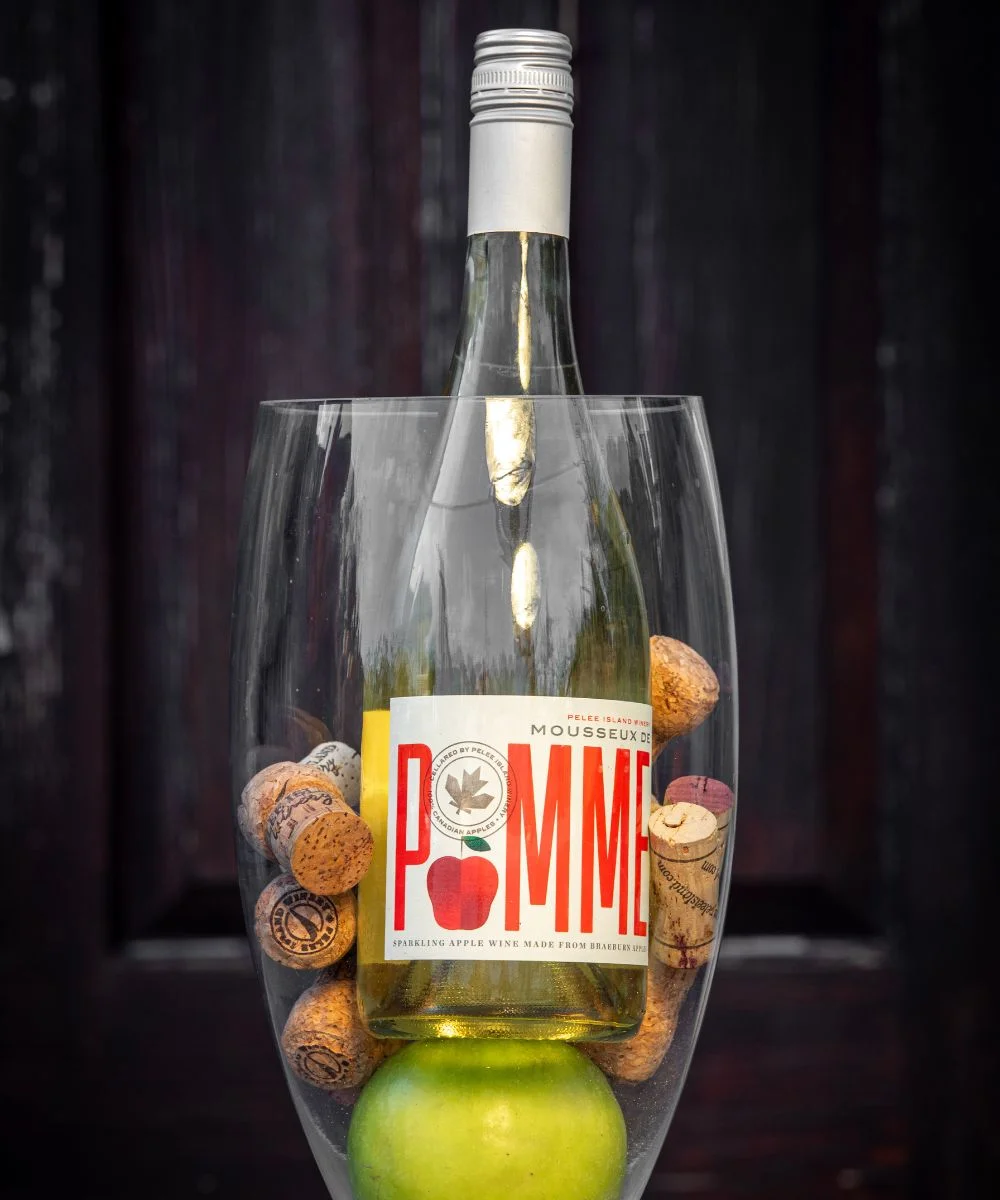 Mousseux de Pomme – Apple Sparkling Wine in a Wine Glass with Green Apple