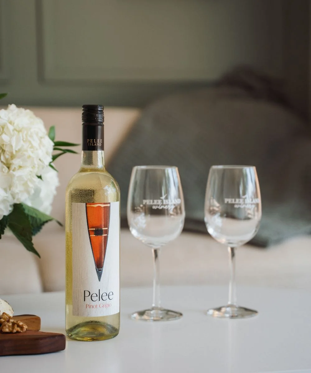 Pelee Pinot Grigio with Two Wine Glasses in the Table