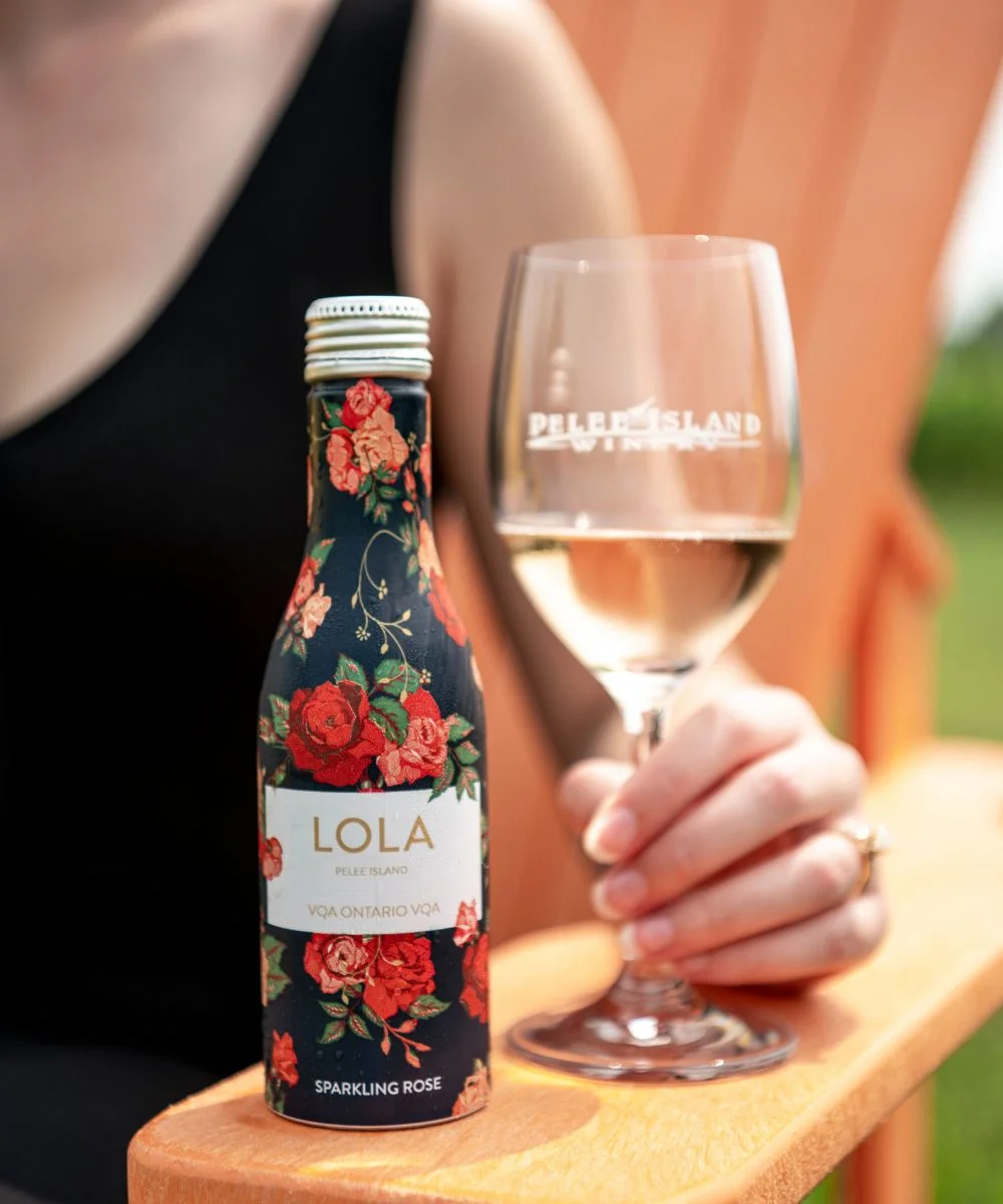 LOLA Sparkling rose with the mini bottle and a wine glass in Pelee Island