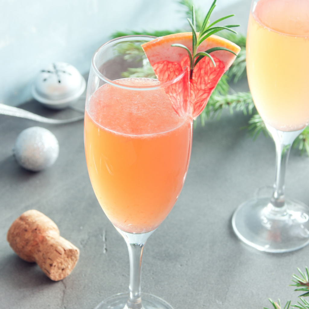 A Royal Cocktail made with Pelee Island Winery's Lola Sparkling Secco VQA Ontario in a flute glass with grapefruit slice.