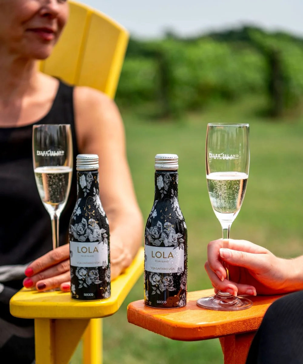 LOLA Secco Sparkling VQA 250mL aluminum bottle with two mini bottles with two wine glasses in the Pelee Island