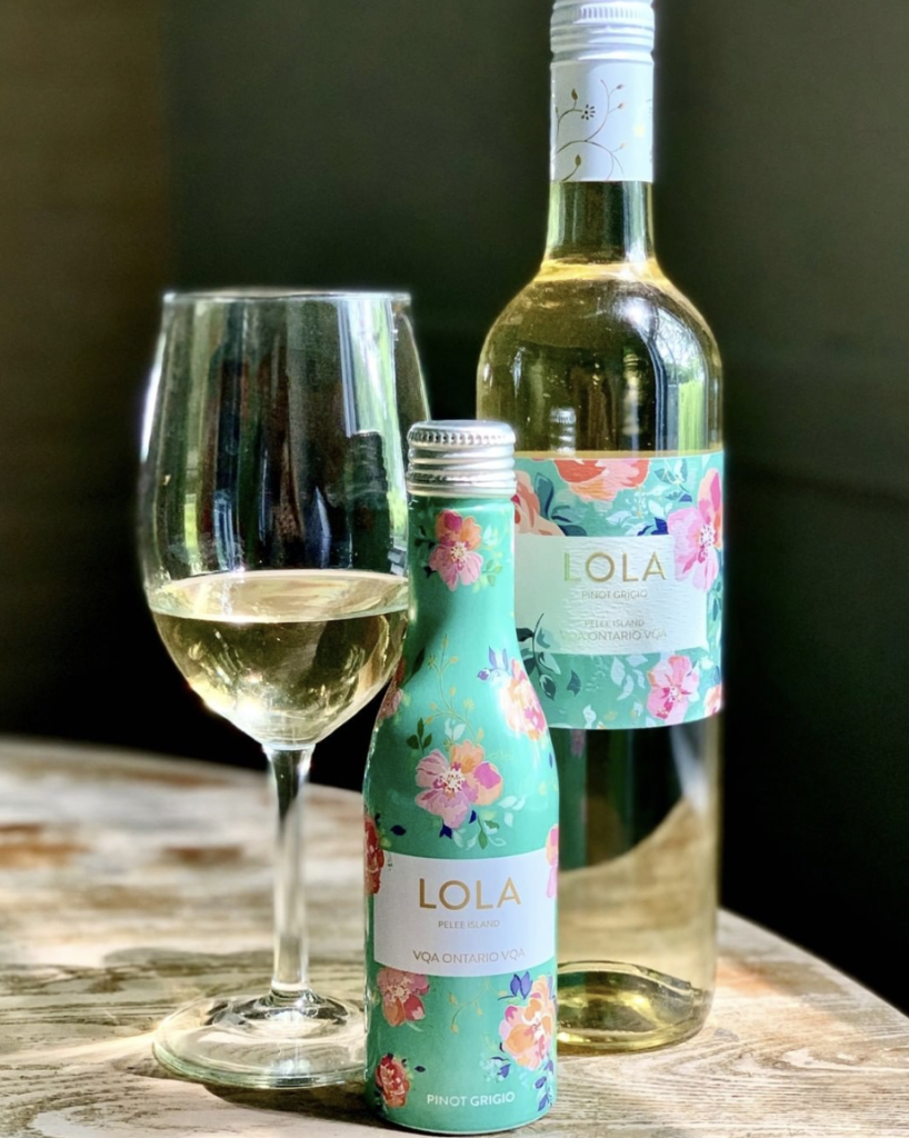 A LOLA full size Pinot Grigio next to a 250mL aluminum bottle of LOLA Pinot Grigio. Some of the wine is poured into a wine glass.