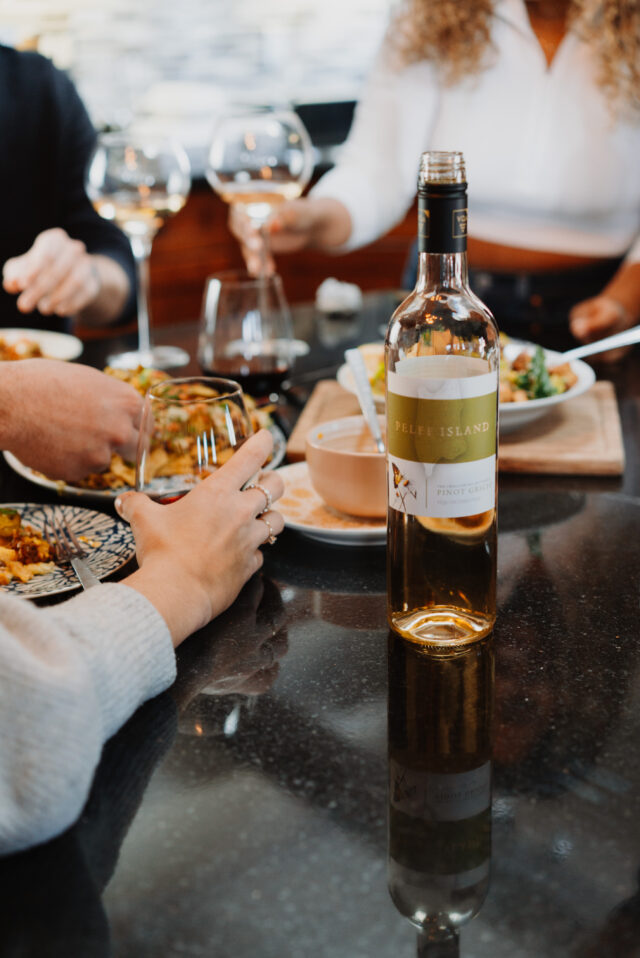 Image of the Pelee Island Pinot Grigio VQA and with the people Eating Dinner
